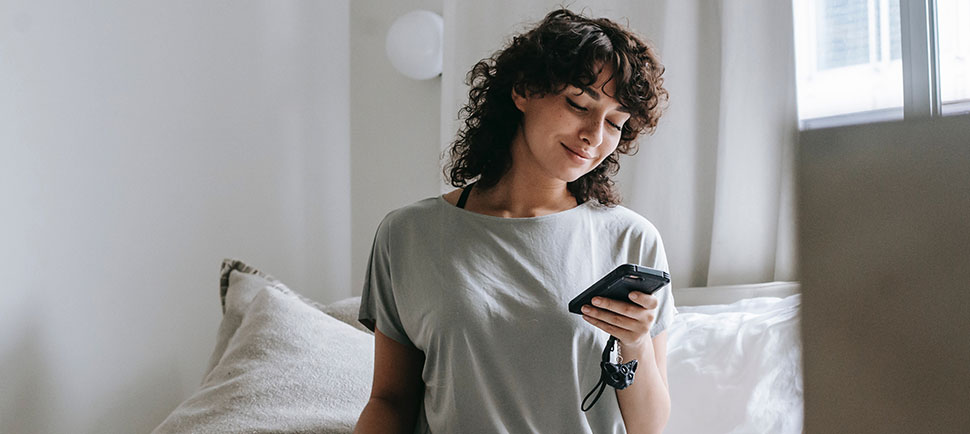 Smiling young female messaging