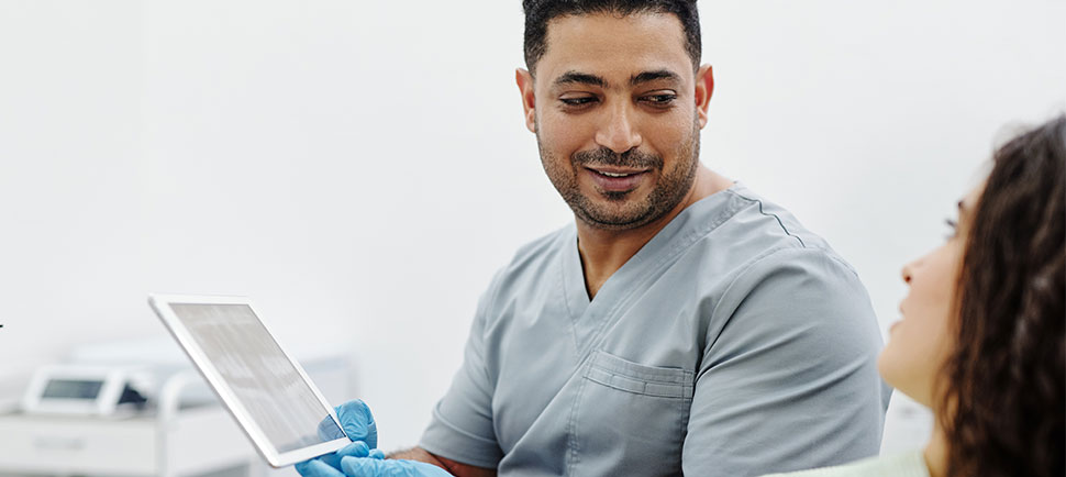 medical professional holding explaining to a patient