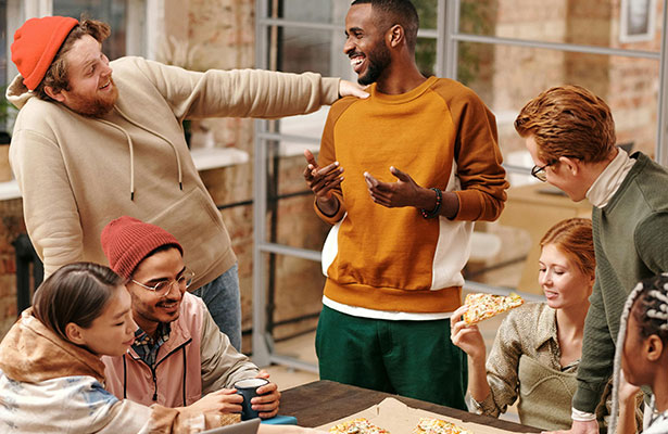 photo of group of people by the table having a good time