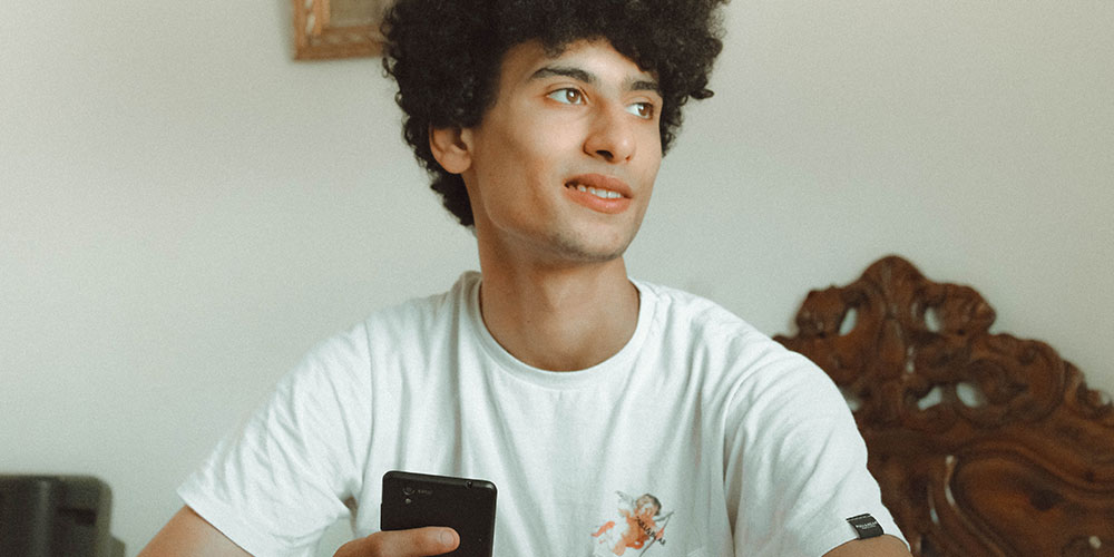 young man smiling depicting healing and recovery