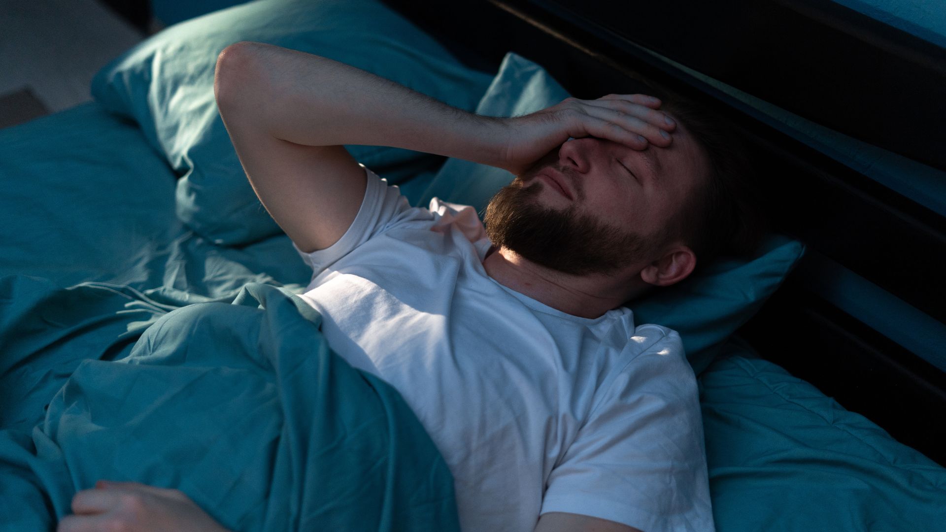 young man experiencing insomnia while doing drug and alcohol detox